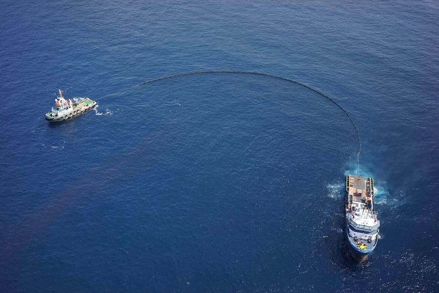 Drones monitoring an oil spill site from above